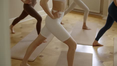 women practicing yoga in a class