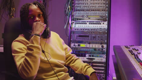 portrait of african american man at work in recording studio