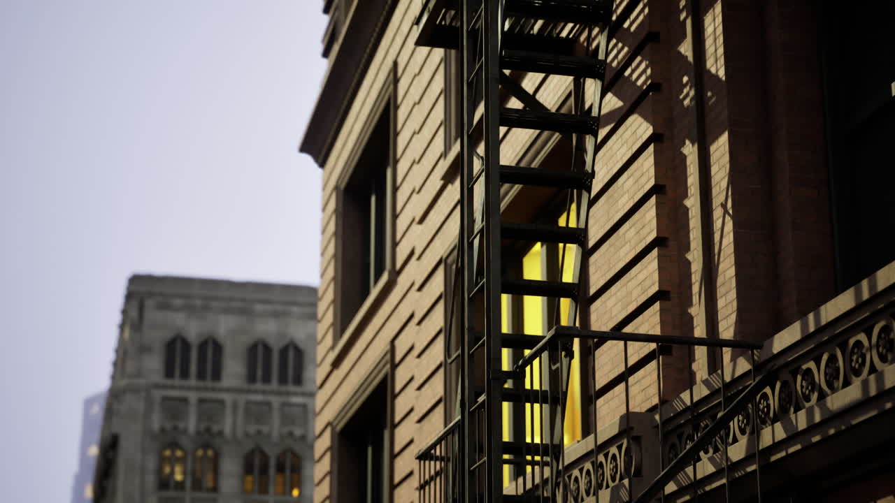 Urban staircase casts intriguing shadows in the evening light of the city