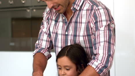 Father-and-daughter-preparing-vegetables