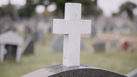 funeral, graveyard and cross on tombstone