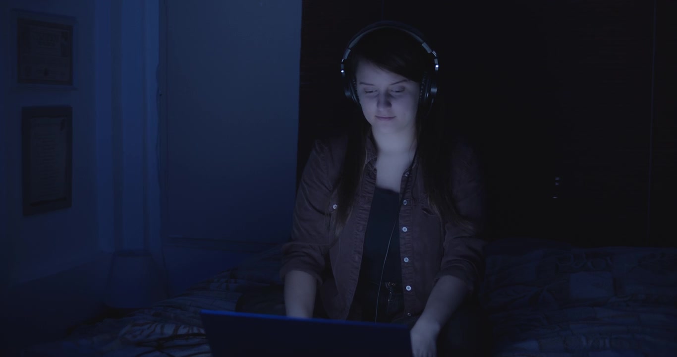 Woman listening to music with headphones