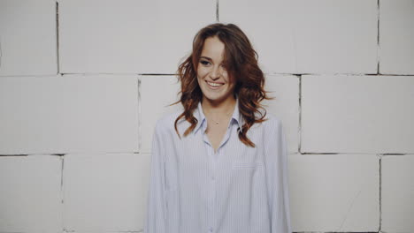 happy woman in a light blue shirt