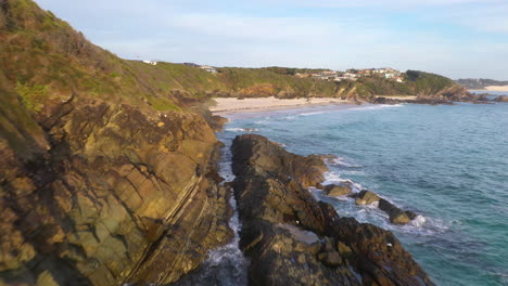 Forster-rocky-coastline-beach-New-South-Wales,-Australia,-sunrise-aerial-view