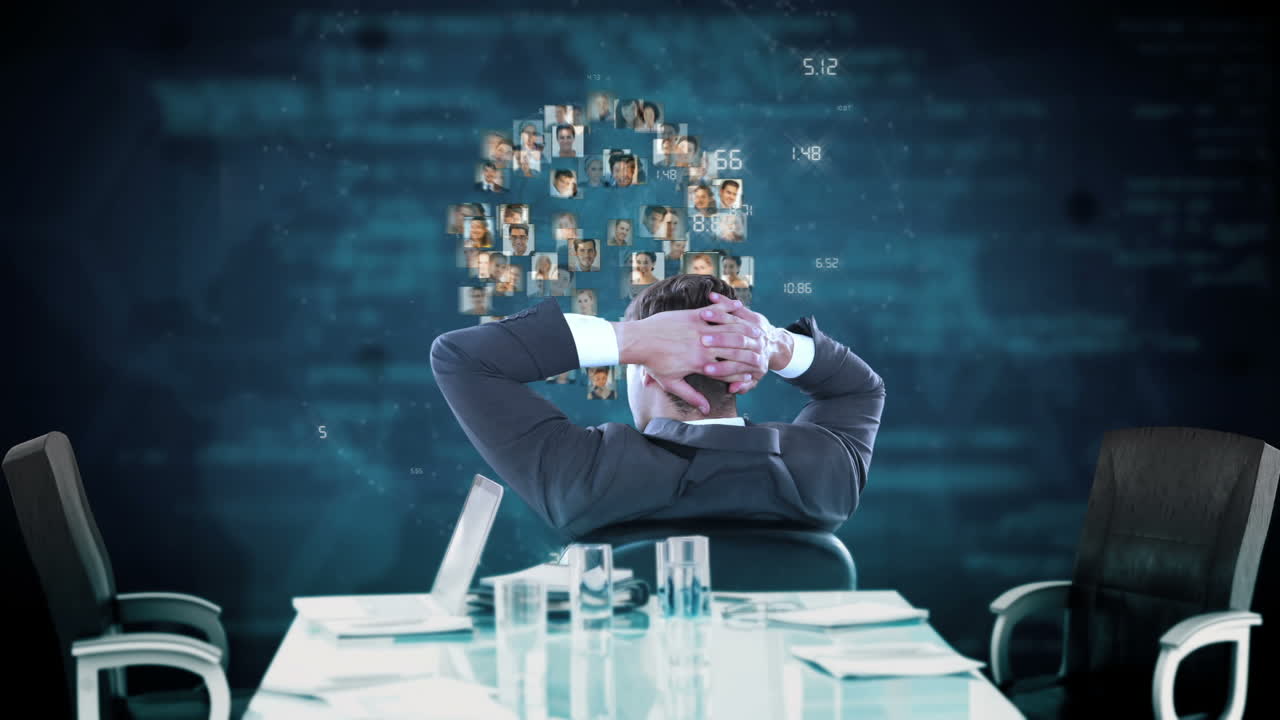 Relaxed businessman looking at digital wall graphics