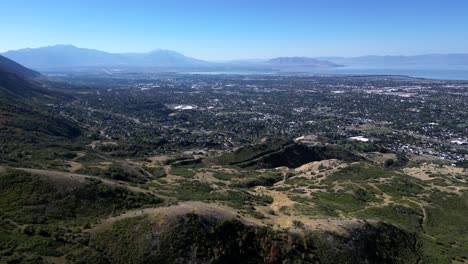 Rotating-aerial-of-towns-Provo-and-Orem,-panoramic-view-of-Utah-Valley