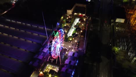 aerial view of the terrace of a building with amusement park attractions