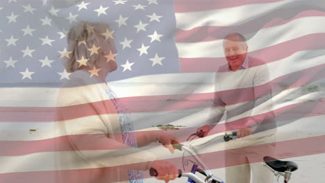 animación de la bandera de américa, pareja caucásica senior con bicicleta en la playa mirándose el uno al otro