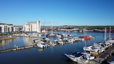 newhaven marina with yachts and boats docked in summer sun in england