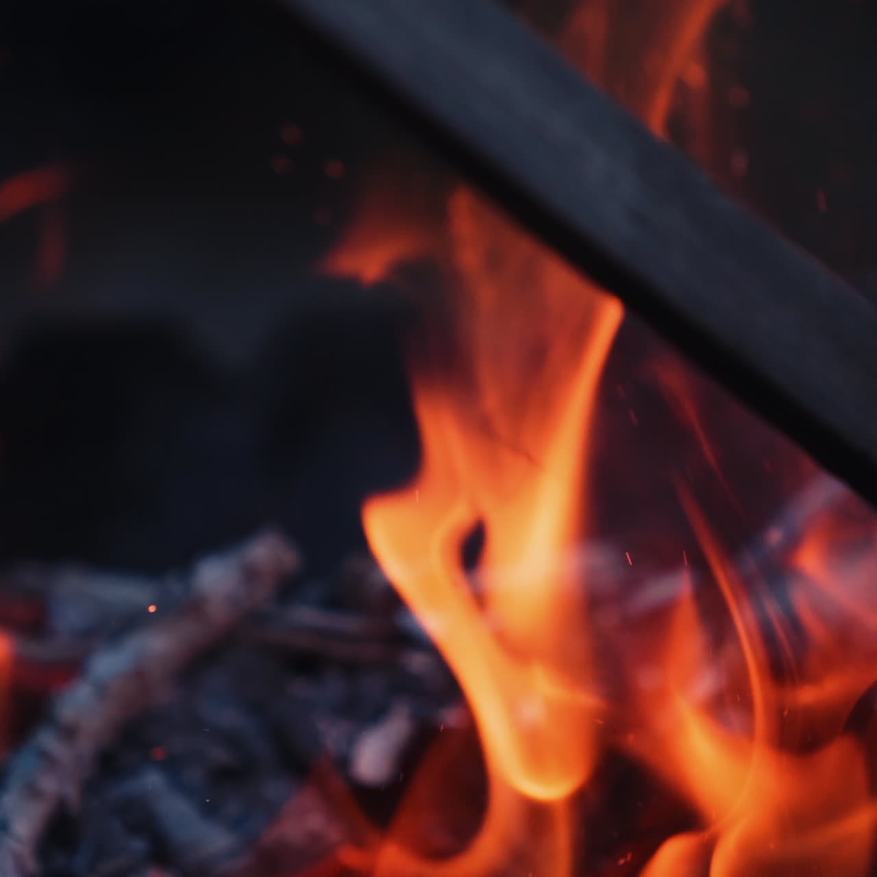 Bonfire. Burning logs in orange flames. Beautiful fire burns brightly. Slow motion