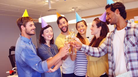 creative business team toasting glasses of champagne