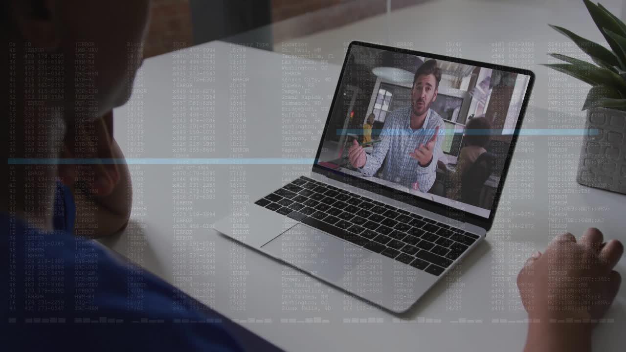 Person watching video call on laptop with data processing animation overlay