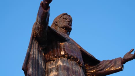 Close-up-of-Cristo-Rei-Jesus-Christ-statue-against-blue-sky-in-capital-city-of-Dili,-Timor-Leste