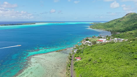 bora bora island, french polynesia, drone shot od famous lagoon and coral reefs along coastal road