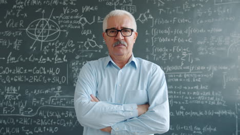 teacher in front of a chalkboard full of equations