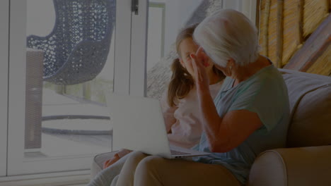 animation of padlock and data processing over caucasian grandmother with granddaughter