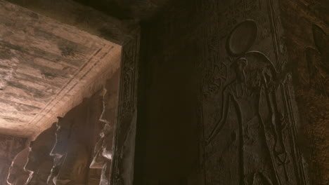 inside of the temple of abu simbel with statues and hieroglyphics