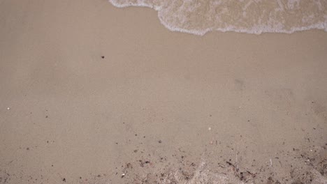 Waves-On-The-Sandy-Beach-from-Above-4K