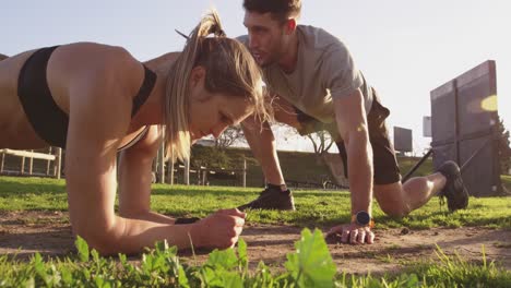 Young-woman-training-at-an-outdoor-gym-bootcamp