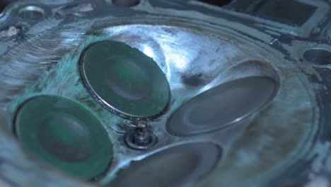 detailed close-up view showcasing the maintenance process of engine valves, focusing on intake and exhaust