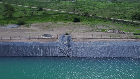 man-made irrigation basin with agricultural pond liner at farmland