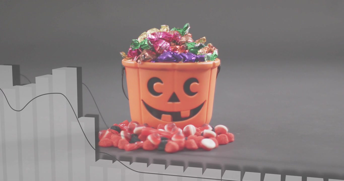 On bucket reveal, bar chart rising and line graph undulating, illustrating candy sales trend