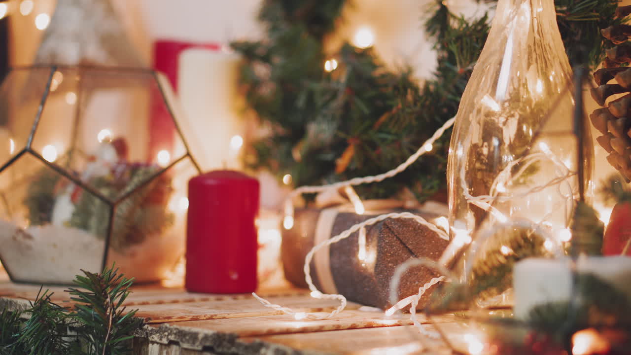close up shot of the men's hands, who holds beautifully packaged boxes with gifts, the person will put them under the tree and give it to friends or family during the celebration of the new year