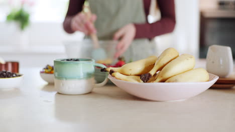 home kitchen, banana and person cooking nutrition