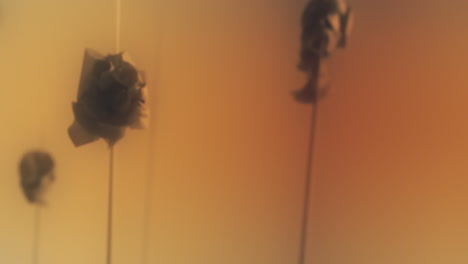 crushed android heads on spikes on the yellow background