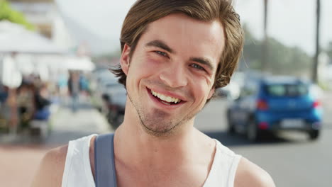 man, face and smile while on a city street
