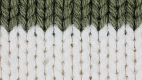 white with green knitting wool texture background - close up, panning