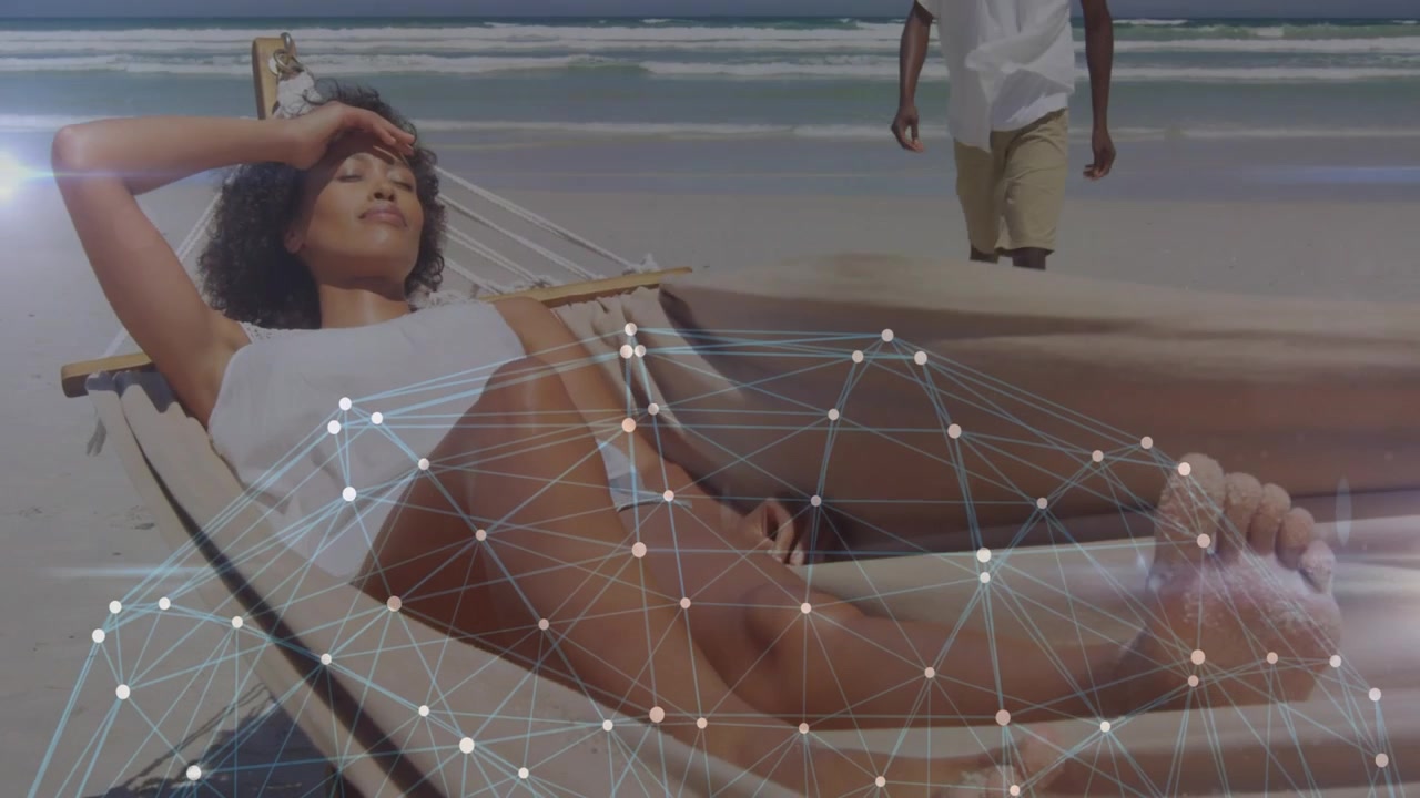 Woman reclining hammock shading, digital mesh appearing over legs, man walking closer showing tech