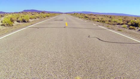 pov shot along a desert road driving fast 2