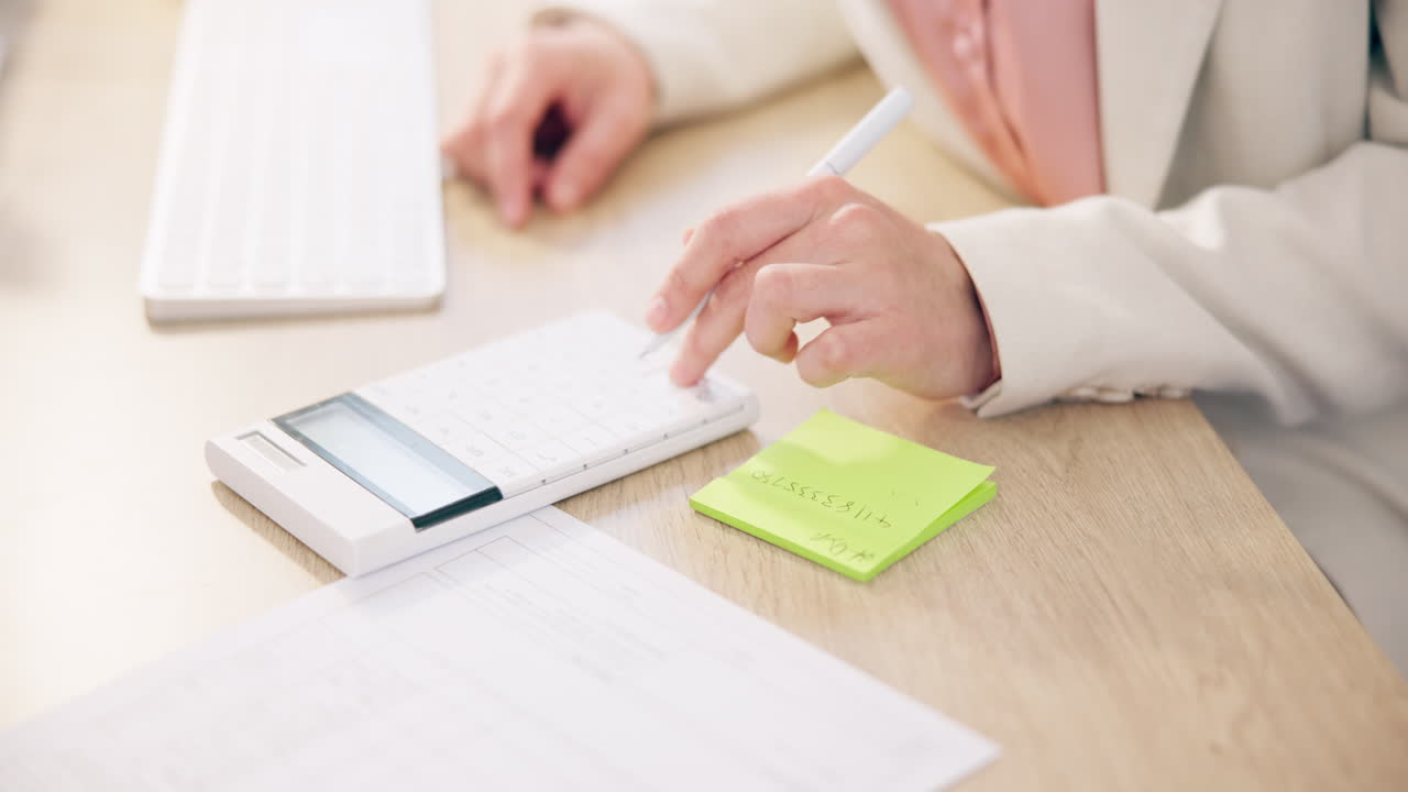 Calculator, hands typing on keyboard