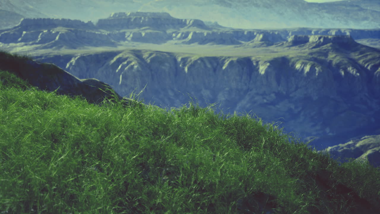 Expansive greenery and rugged mountainous landscape at golden hour