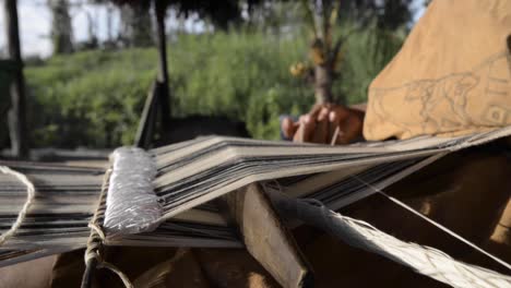 indigenous woman weaving in the peruvian jungle