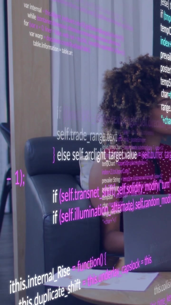 Vertical video: Woman working on laptop, causing tech overlay growing and hiding view while turning