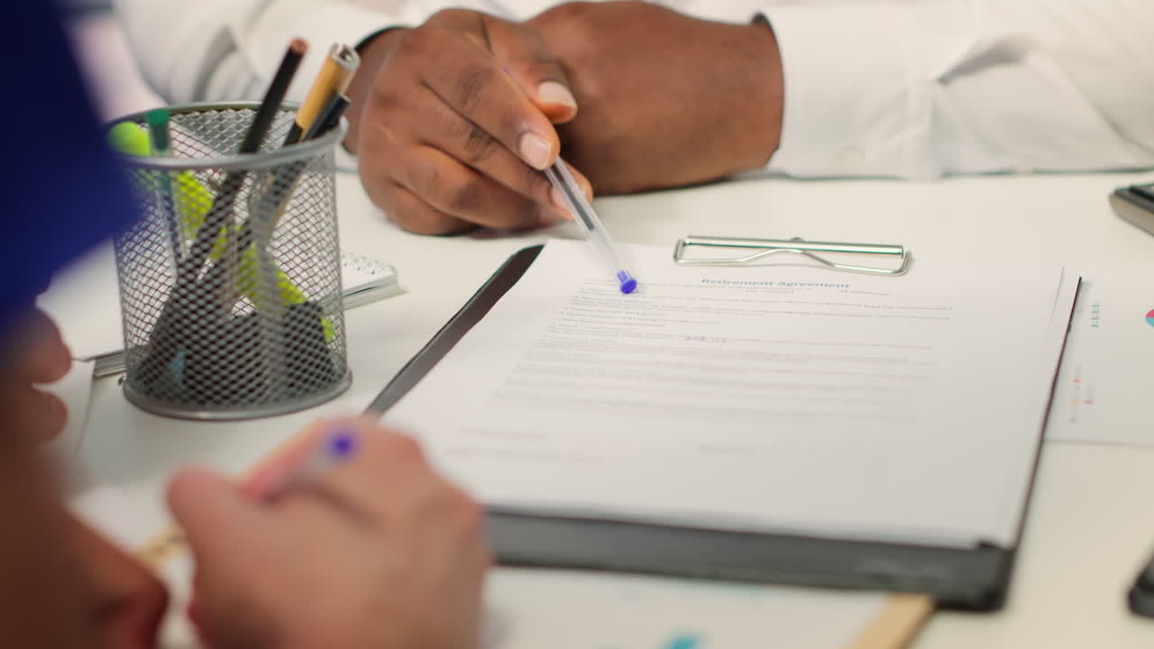Mature couple consulting an adviser to explore retirement options
