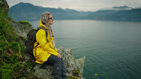 woman hiking at lakeside mountain view