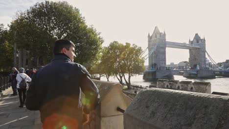 tourist take pictures of tower bridge from tower