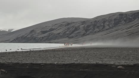 Wide-shot-of-beach-on-desolation-island,-isolated-volcano-in-the-ocean