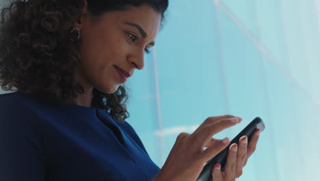 independent-business-woman-using-smartphone-texting-female-executive-checking-emails-browsing-messages-on-mobile-phone-in-office