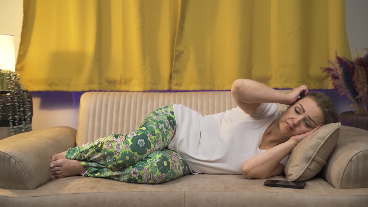 Woman being thoughtful in bed.