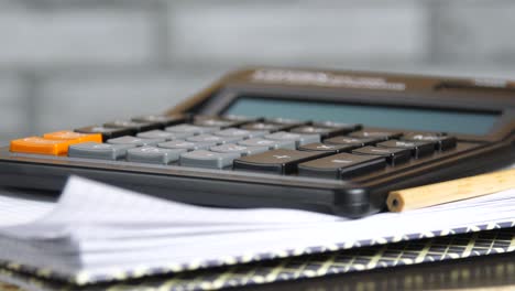 calculator, pencil and copybook, rotate