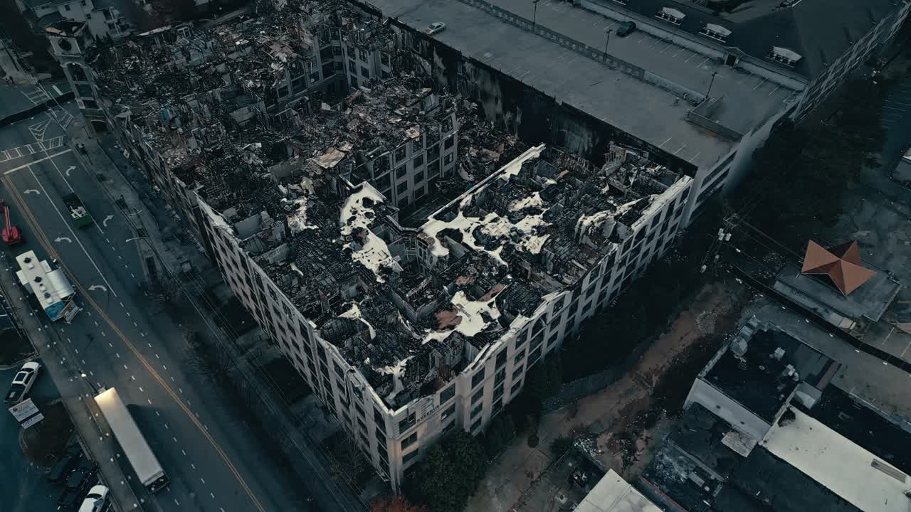 Ash and coal of skyscraper neighborhood after fire