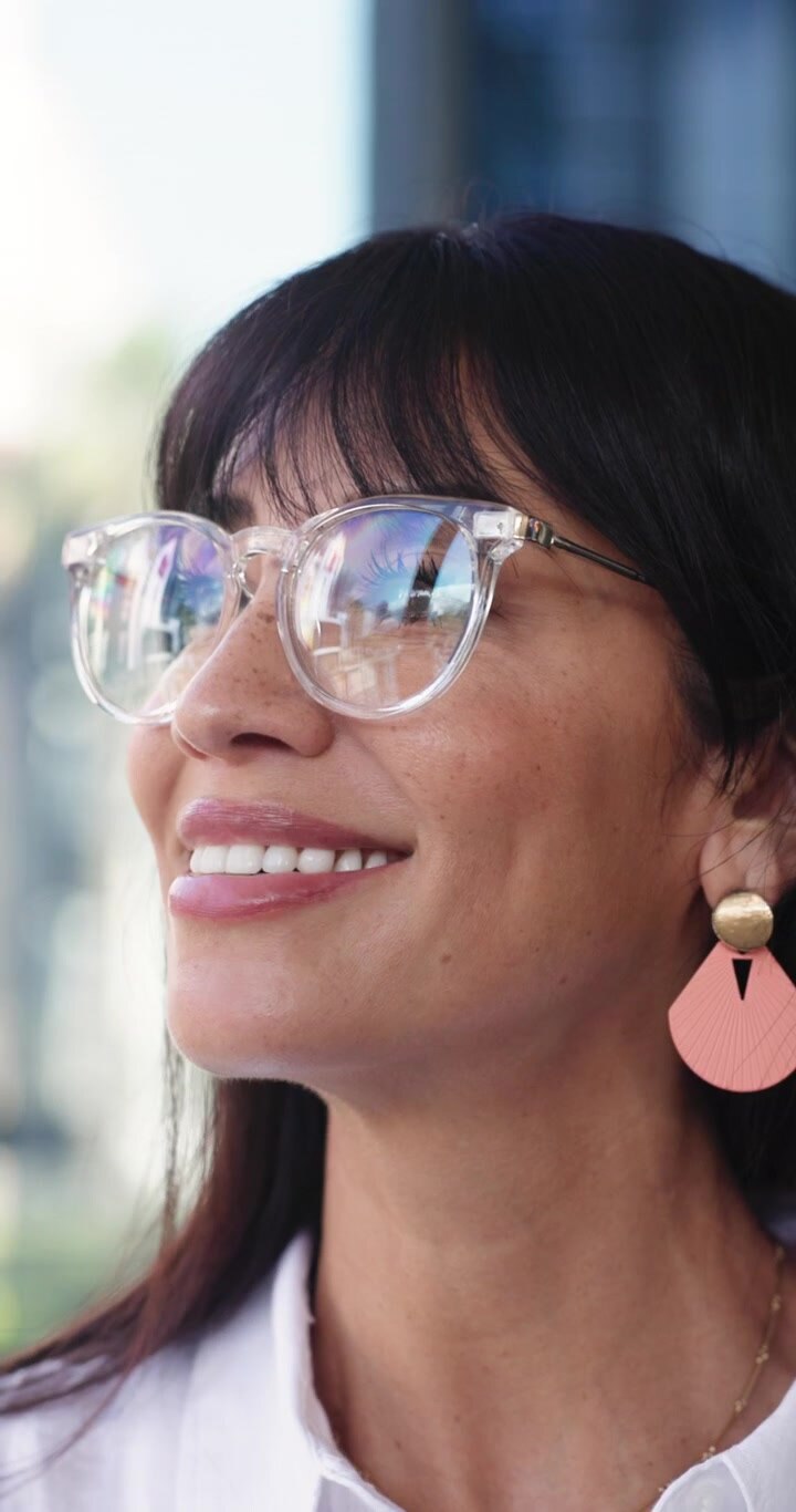 Portrait of a Smiling Woman Wearing Stylish Glasses
