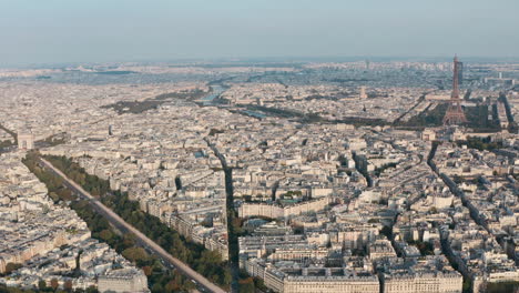 dolly back drone shot of west paris eiffel tower and arc de triomphe