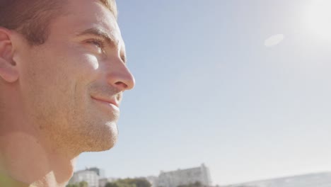 Young-man-on-a-beach-smiling