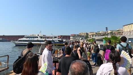 people boarding a ferry in sorrento, italy