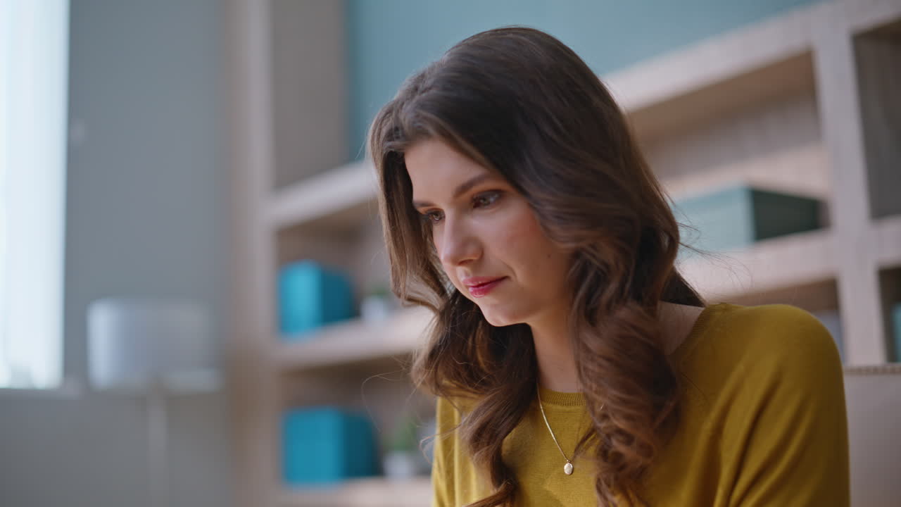 Smiling girl typing computer at cozy home workplace closeup. Woman freelancer